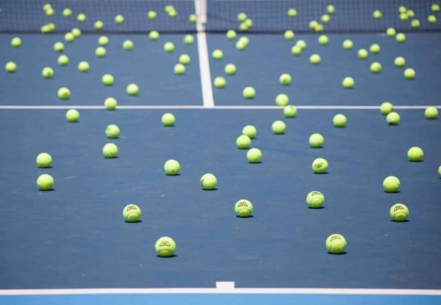 brands-people-xq0vBuCD_Jo-unsplash (1) tennis ball on the court